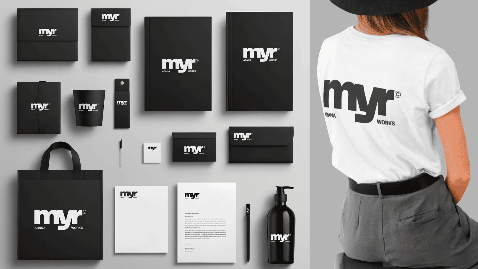 Black and white Myr Abana Works brand identity mockup with stationery, notebooks, tote bag, packaging and t-shirt